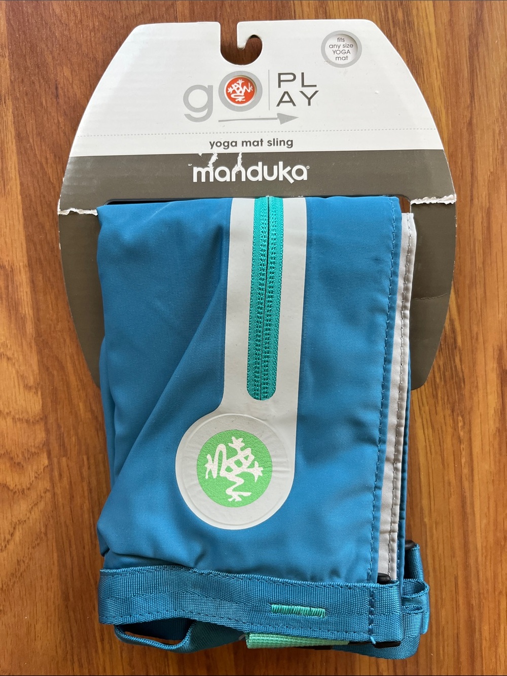 manduka teal yoga mat sling with white and mint accents